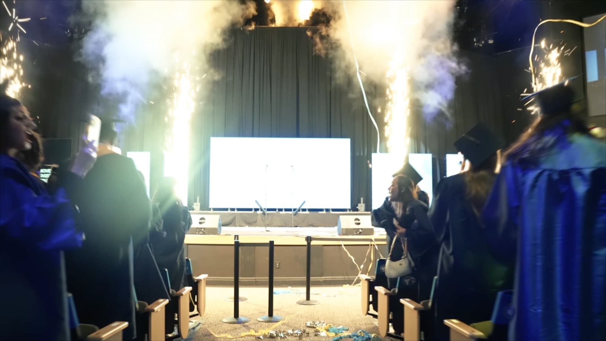 Cold spark fountains and confetti firing on stage at the IRSC commencement